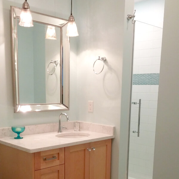 bathroom update clean white marble vanity with blue glass accent tiles