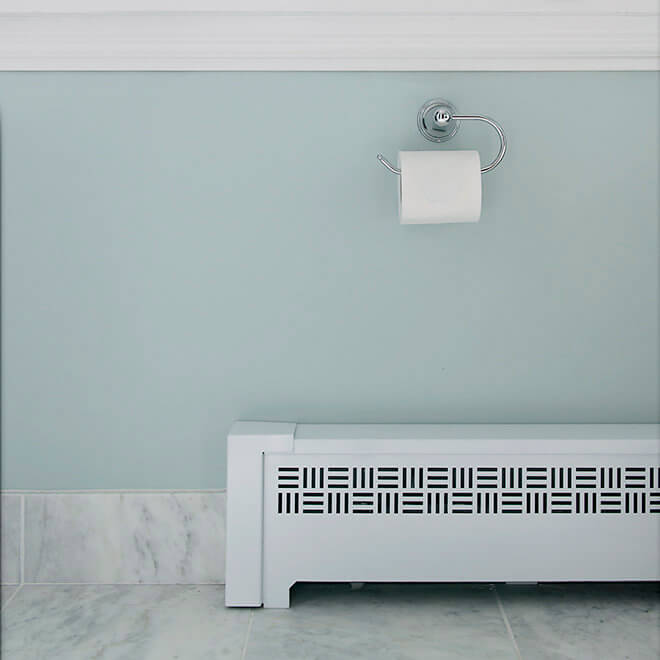 beautiful custom bathroom radiator cover and marble flooring