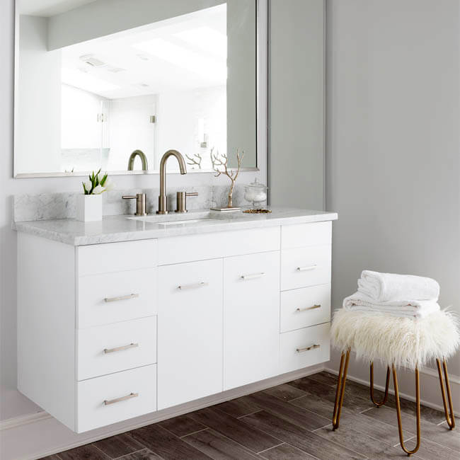 White Luxury Bathroom floating vanity, natural stone wall, natural light from skylights - Halifax Case